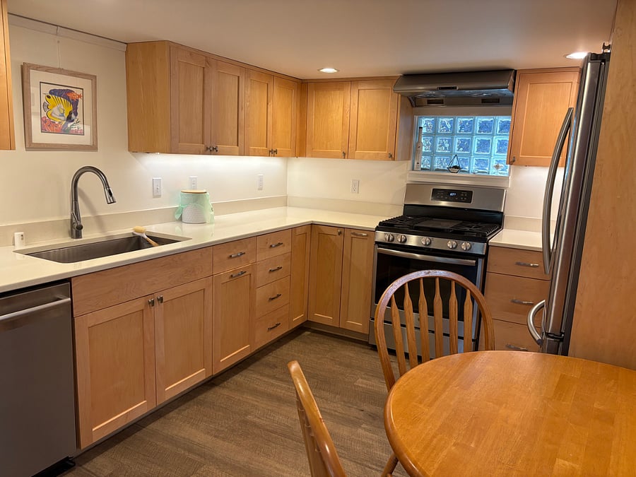 Chef's kitchen with full-sized stainless-steel appliances, including dishwasher