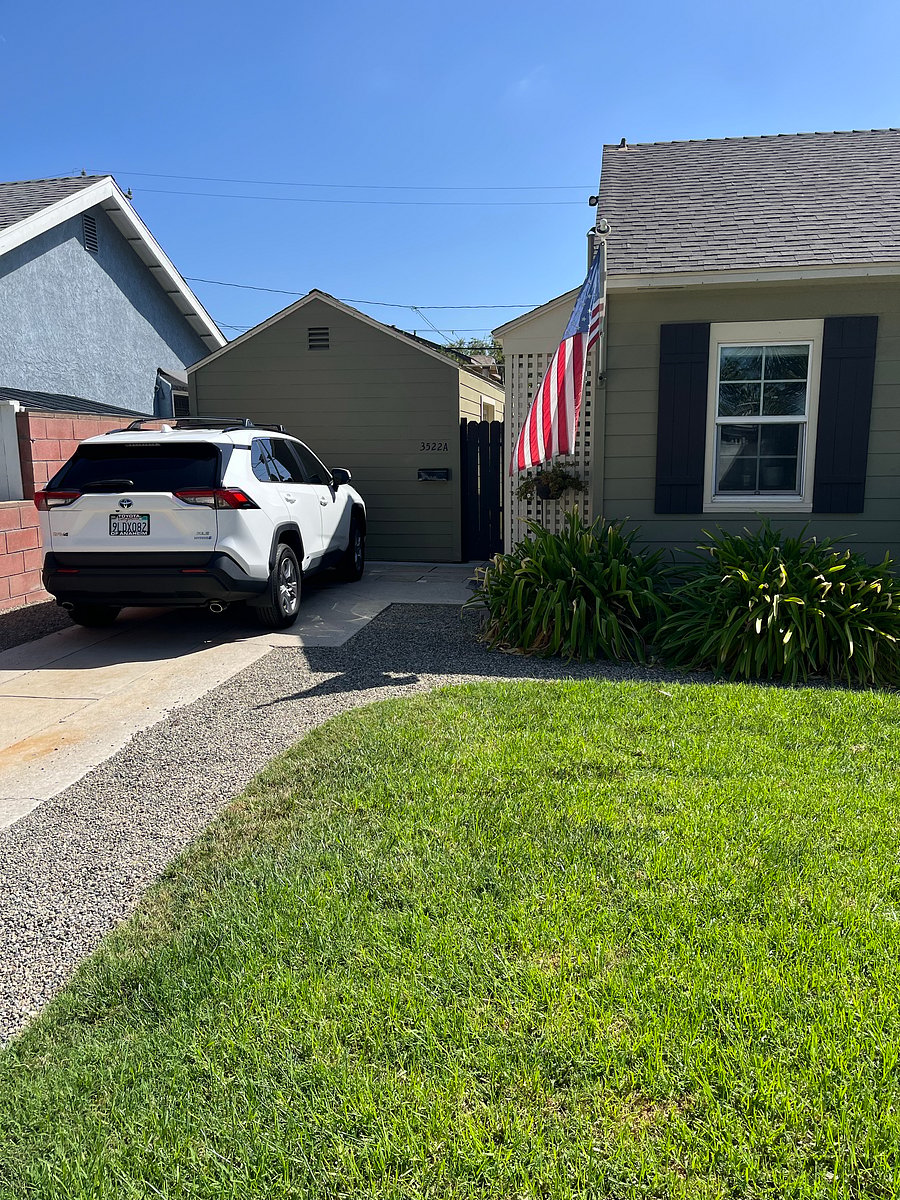 Our Cute Cottage is just in front of the parked vehicle with entrance through the gate.