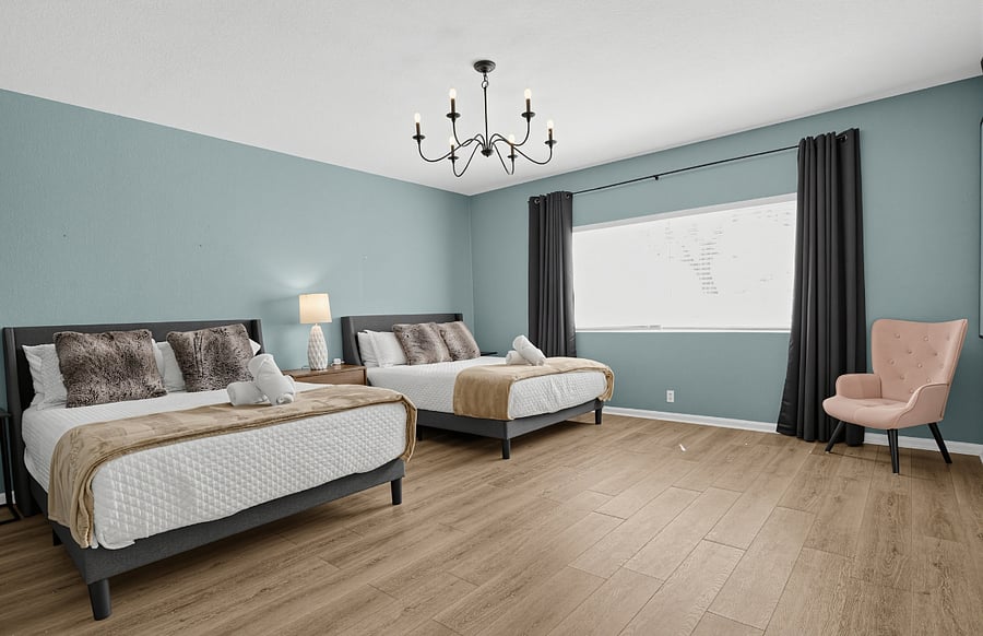 Main bedroom downstairs with two queen size beds