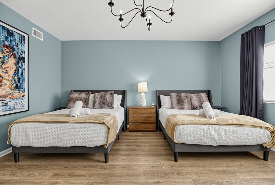 Main bedroom downstairs with two queen size beds