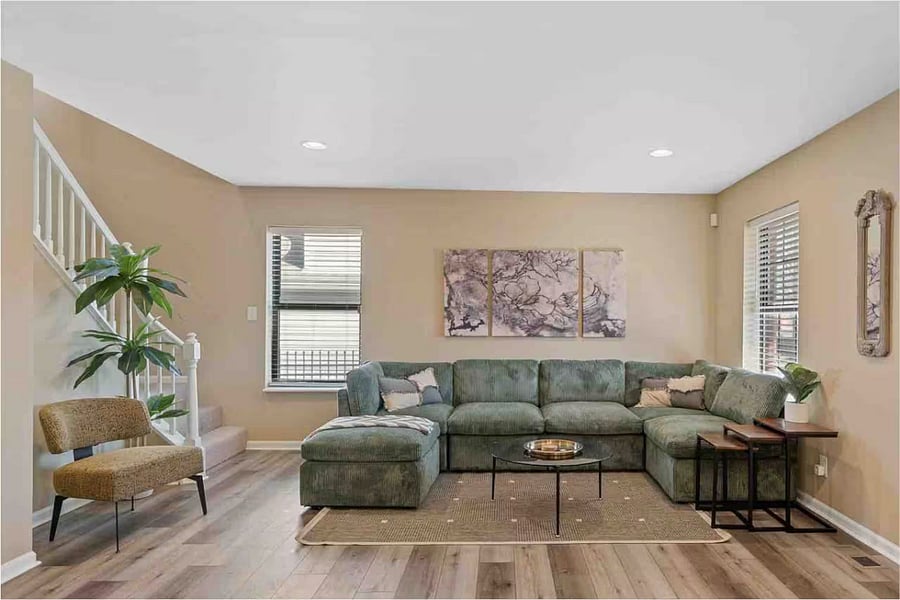 The kitchen flows into a sunny breakfast nook with banquette seating.