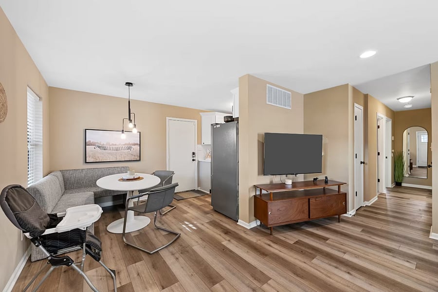 This bedroom includes a comfortable bed, nightstands, and a sliding-door closet.