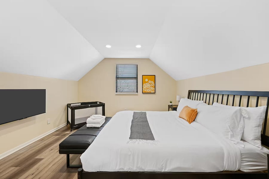 The upper bathroom features black hex tile floors and a glass-enclosed shower.