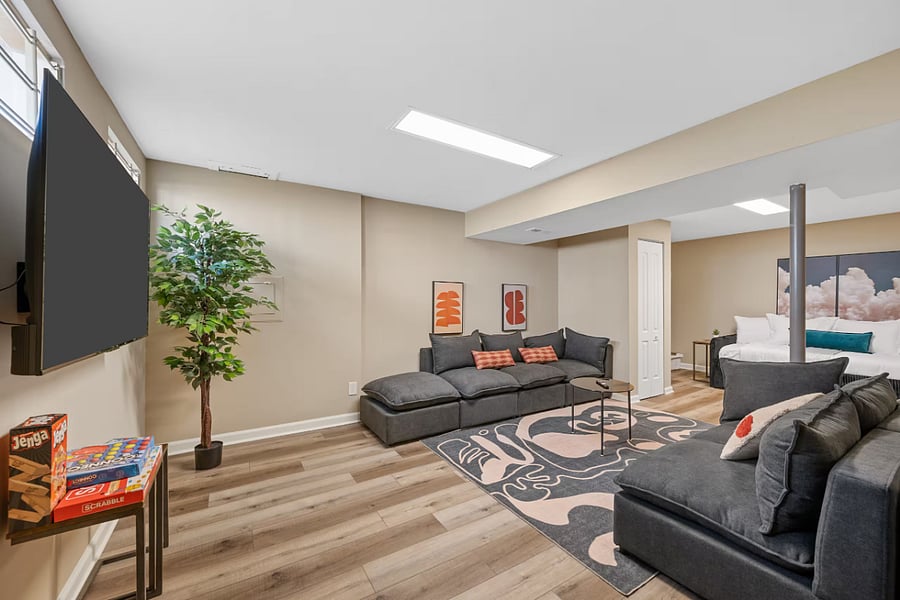 The unfinished basement recreation space includes a pool table, fireplace, and laundry.