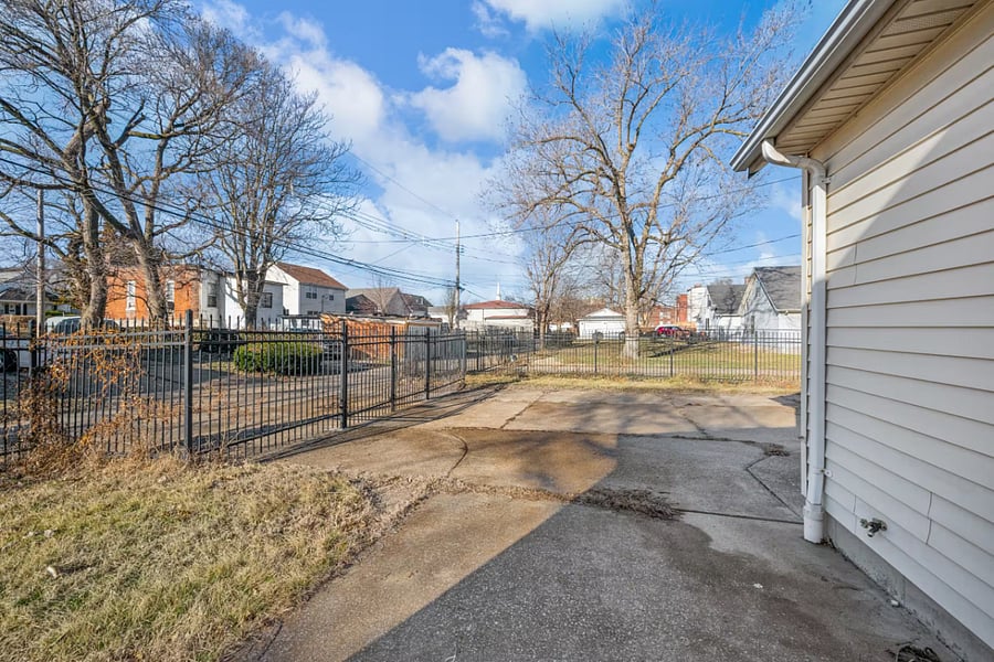 Side parking and an attached garage complete this convenient exterior setup.