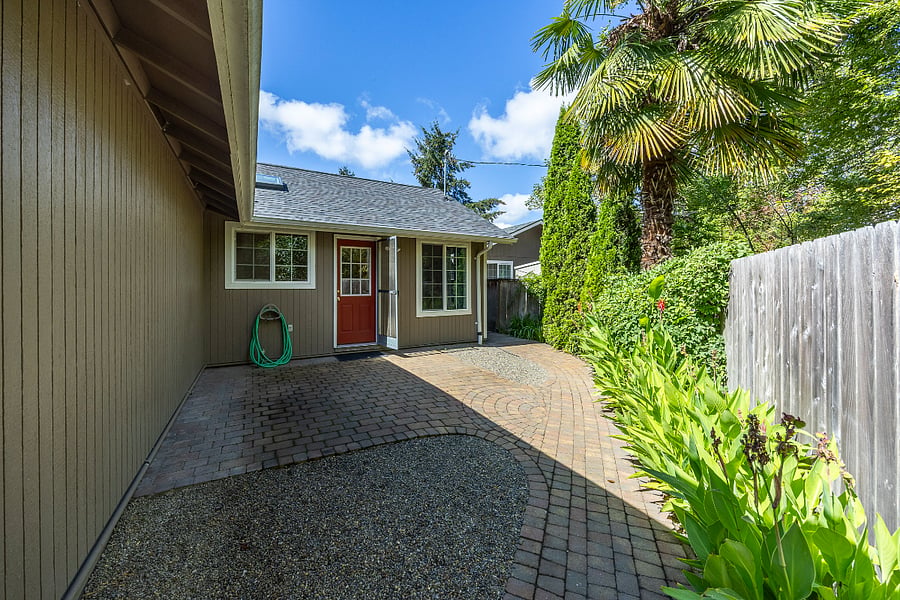 Lovely patio right off the kitchen/dining area with path leading to the garens/yard.