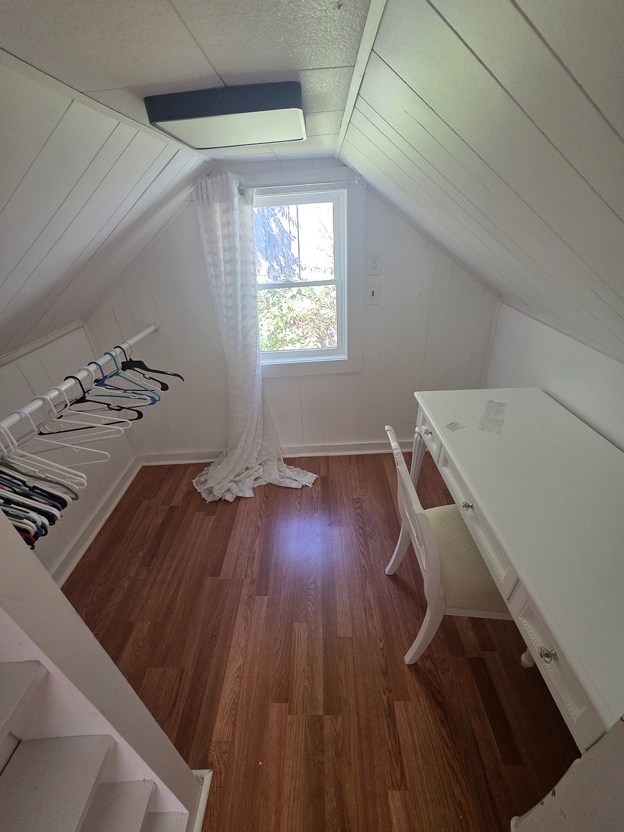 Loft desk area with shelving and hanging space