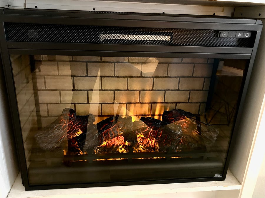 Electric fireplace to warm and add fun vibes to the living room.