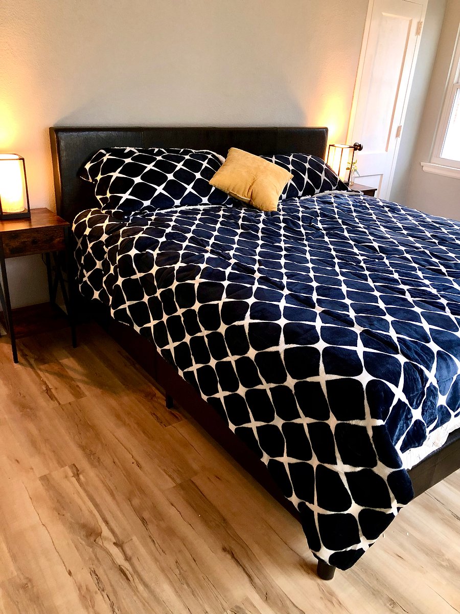 Master bedroom has king bed, sitting area and closet.