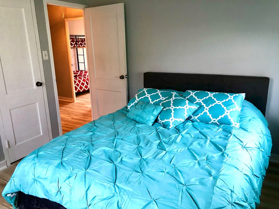 2nd bedroom has queen bed, computer desk and closet.