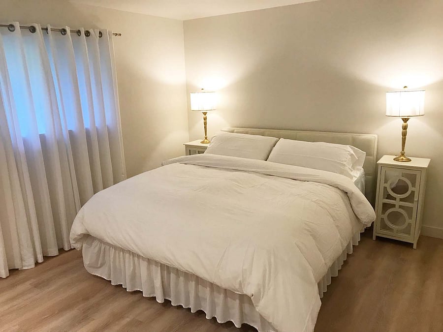 Bedroom 1: California king bed, nightstands, dresser, large closet with en suite bathroom