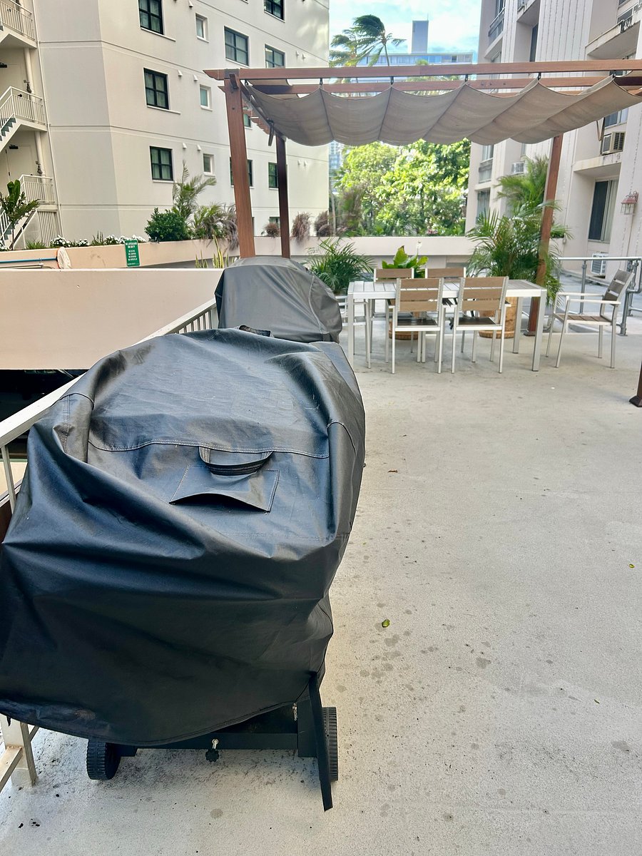 Two grills at pool area and large patio area for relaxing.
