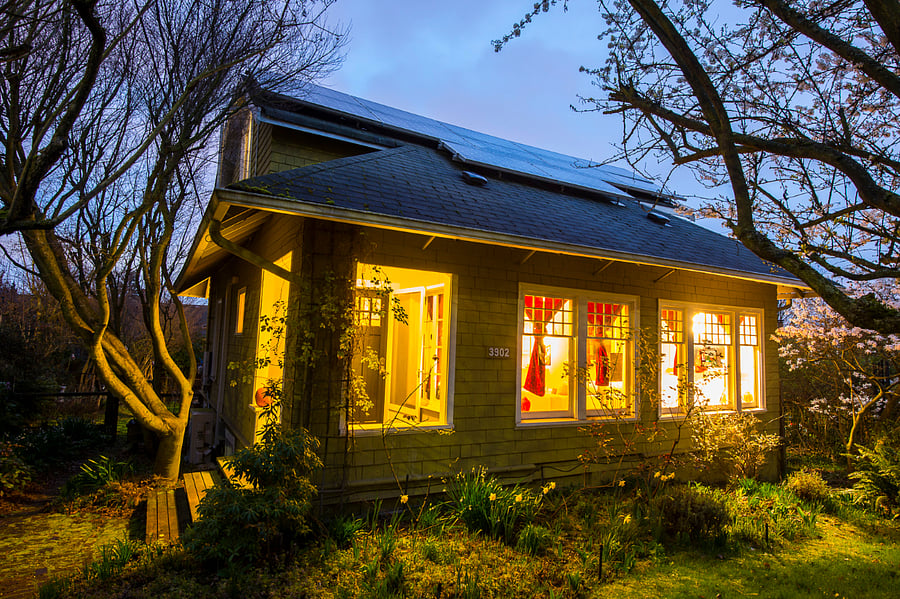 At dusk, our home welcomes you in warm light