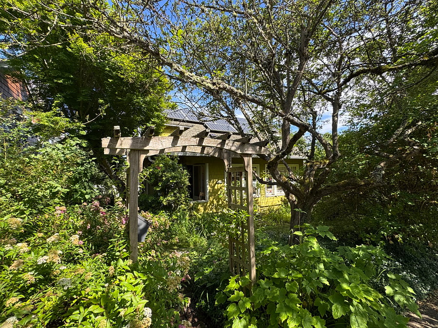 Trellis entry to garden with path to front door