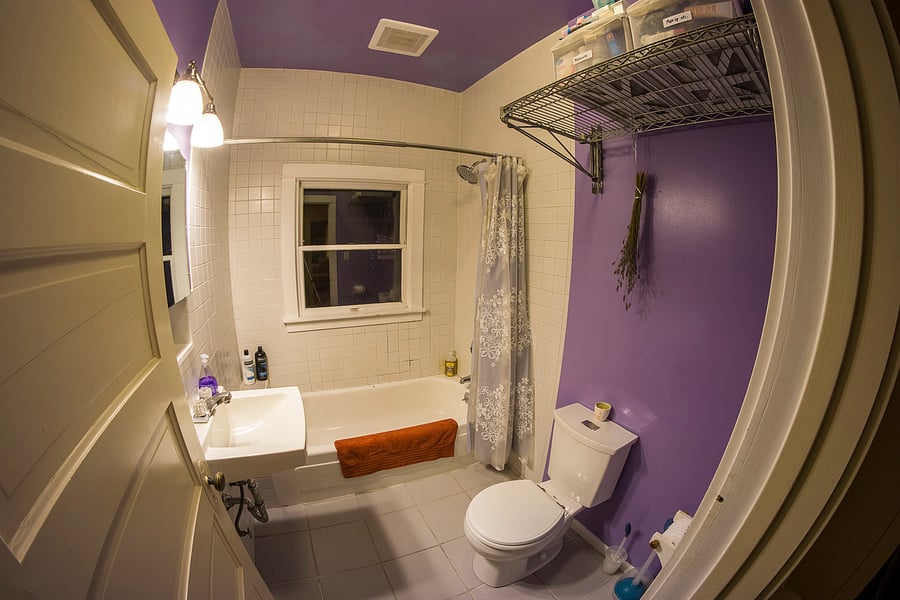 Full bathroom with newly tiled bath/shower.