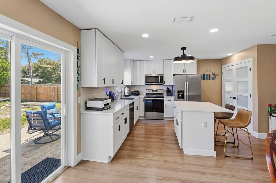 Side view of newly remodeled kitchen showing proximity to outdoor dining area.
