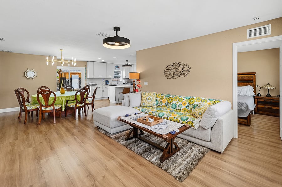 Family room featuring new sectional and large 6' dining area with 8 matching chairs