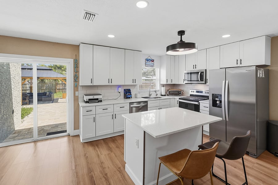 Newly remodeled kitchen with stainless steel appliances, Ninja combo air fryer/toaster/air oven, new microwave, new range, new spacious side by side matching refrigerator with 5 stage reverse osmosis drinking water and ice