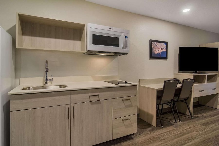Guestroom; kitchen, desk, dresser/tv