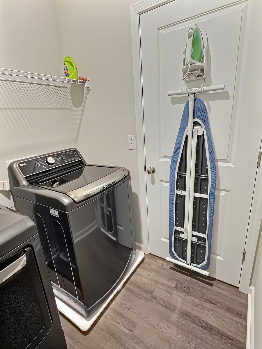 Wash room includes: iron and ironing board