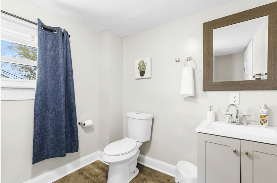 The main-level bathroom features a clean, updated design with a walk-in shower for easy and convenient use. Our bathrooms are fully stocked with plenty of towels and the basics.