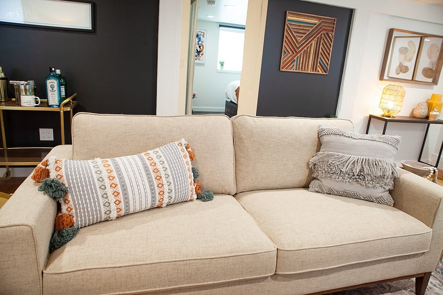A comfy couch to relax after a day touring the city.