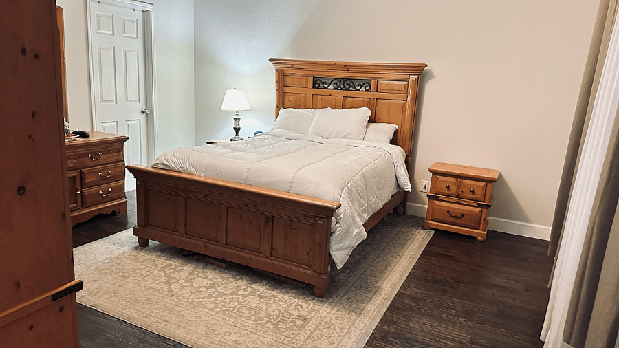 Downstairs primary bedroom with private bath and smart TV