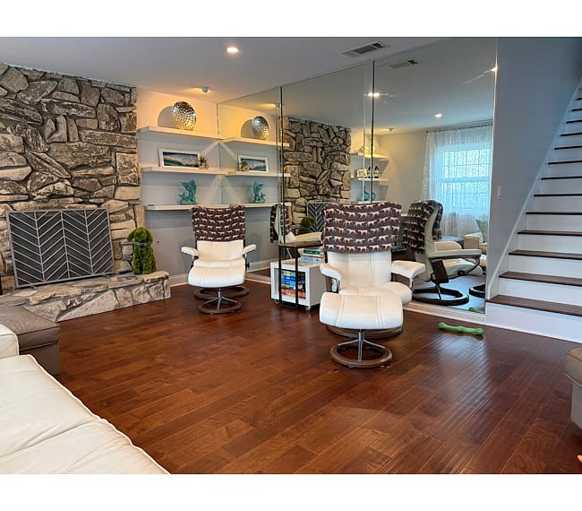 Main living room, shared area. Features 65" smart tv and fireplace.
