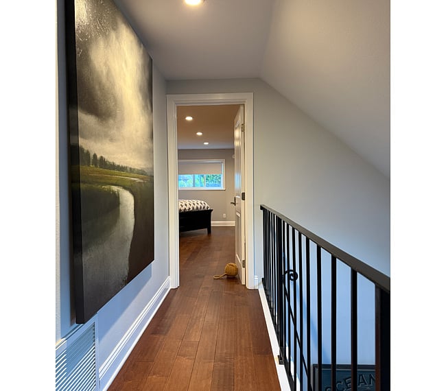 Catwalk at top of stairs leads to main suite entry with keypad lock.