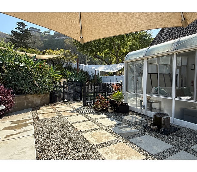 Behind the gate is a dedicated outdoor area for Atlas' needs, with gate access to driveway. This is a shared space.