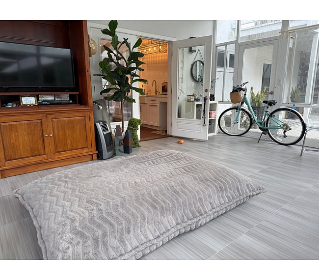 Glass, screened sunroom just off kitchen. The perfect spot to listen to the rain! Access to garage and back yard patio area. Includes smart tv for streaming. Great exercise spot. This is a shared space.