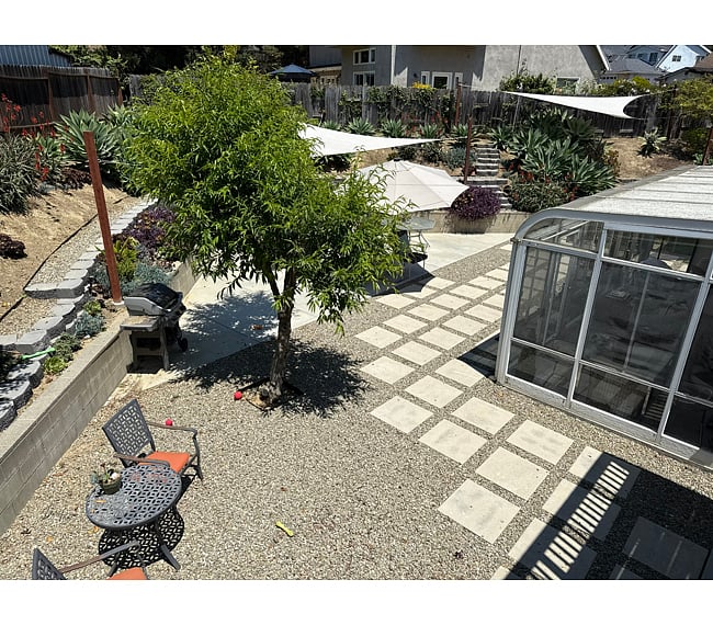 Backyard patio and sunroom. These are shared spaces.