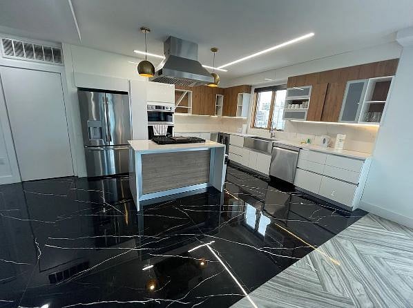 Two bar stools are also included at the kitchen island