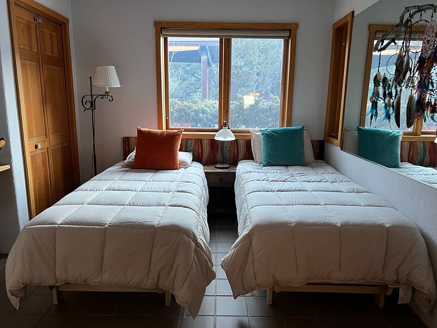 Second bedroom: two twin extralong beds. They can be pushed together to form a king (same size).  