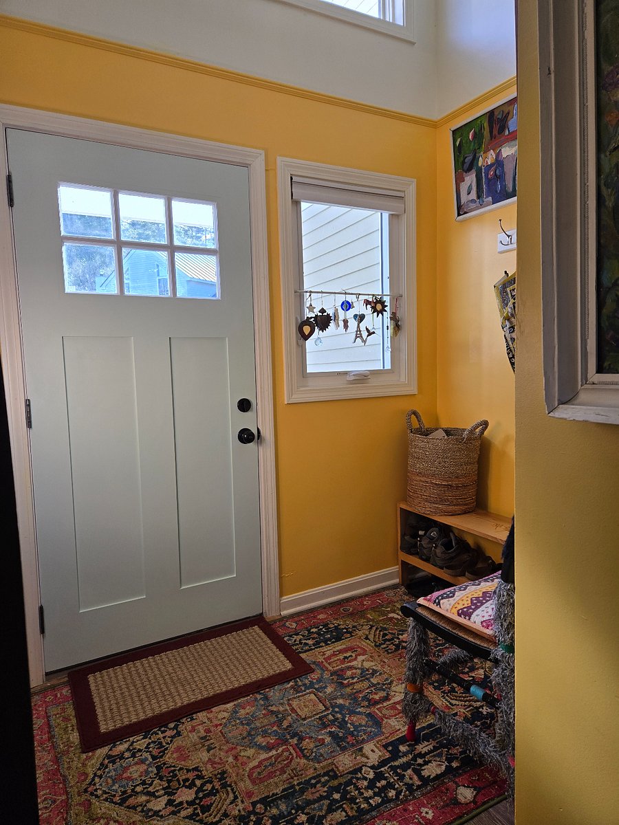 Entryway with shoe rack & coat hooks.