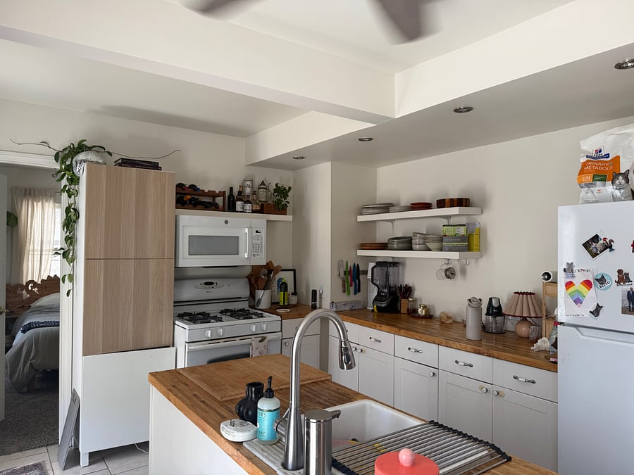 Kitchen. Outdoor deck is off the kitchen. Your room is also off the kitchen