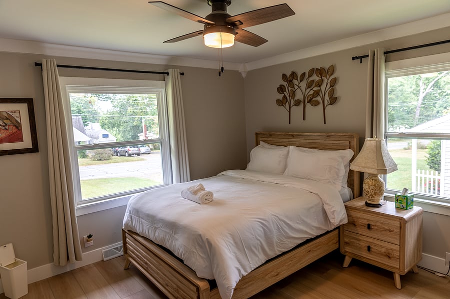 Queen bed with TV and dresser