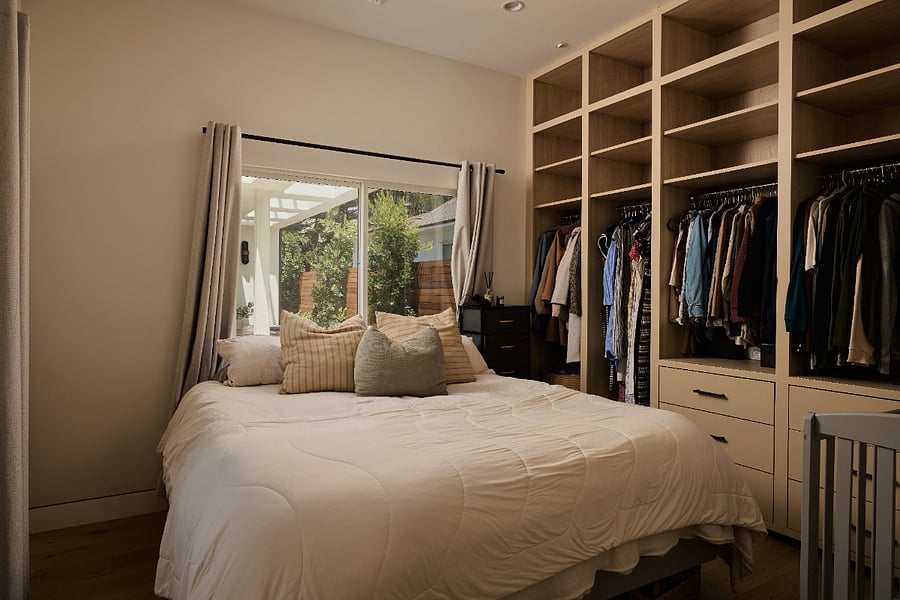 Bedroom 1: Queen bed provided. Built-in closet with ample drawer and hanging space.