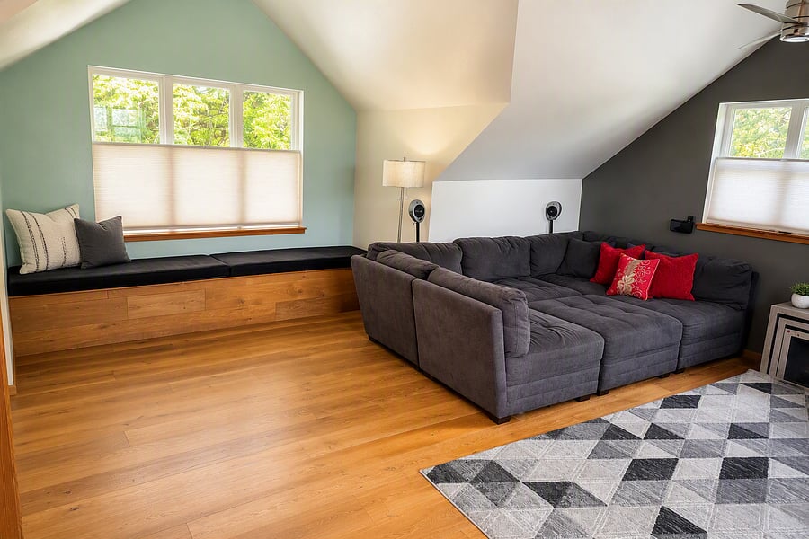 Media room - Large sofa area with reading nook by the window (angle 1)