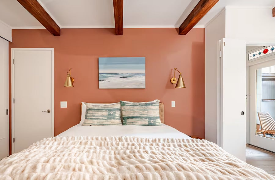 Primary bedroom include queen bed, desk, California Closets closet system.