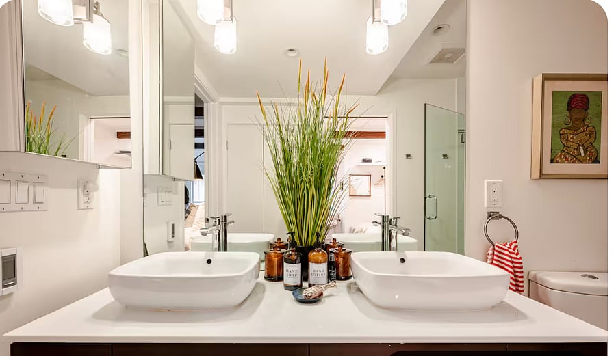Maine bathroom with double vanity, walk in shower.