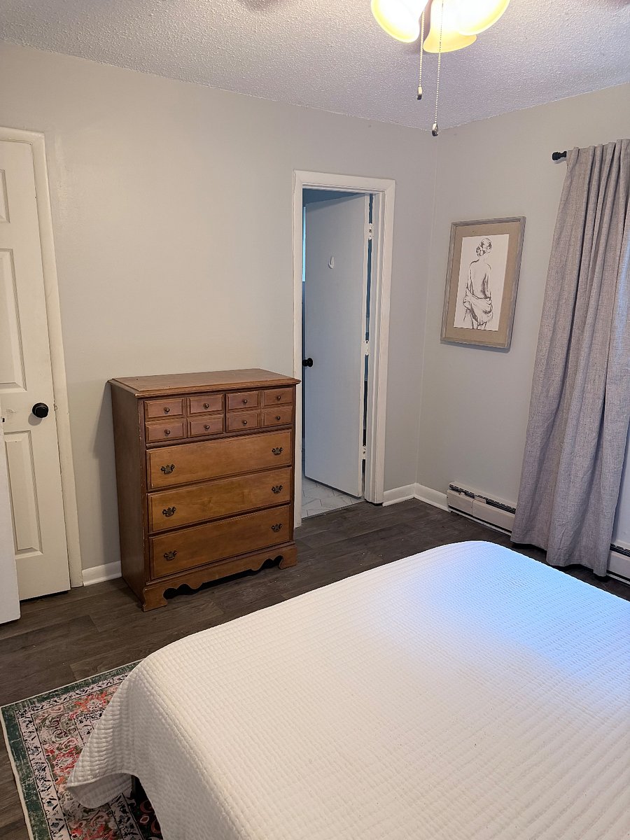 Bedroom includes a full-size chest plus easy access to the bathroom and walk-in closet. Curtains are blackout for night shift workers who need to sleep during the day.