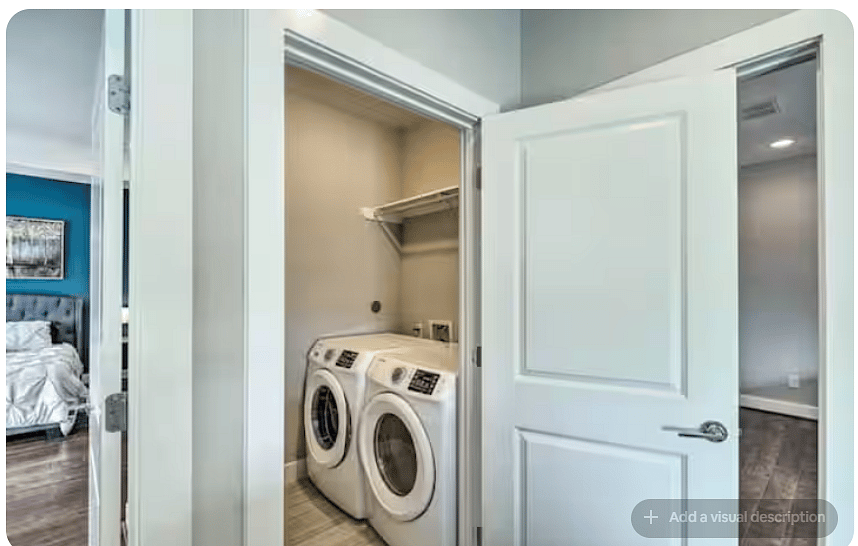 Convenient in-unit laundry area with a full-size front-loading washer & dryer.
Built-in shelving provides space for laundry essentials, while its location near the bedrooms makes longer stays and everyday routines easier.