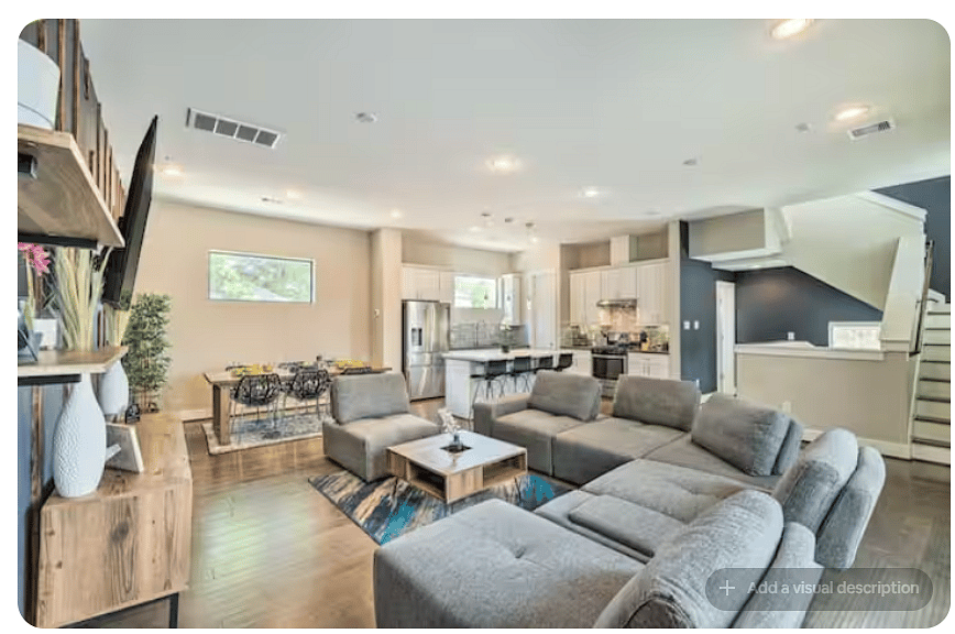 Spacious open-concept living area connecting the lounge, dining space & kitchen.
Large sectional offers plenty of seating, while the kitchen island adds bar seating.
Bright, open layout makes gathering, dining & relaxing easy.