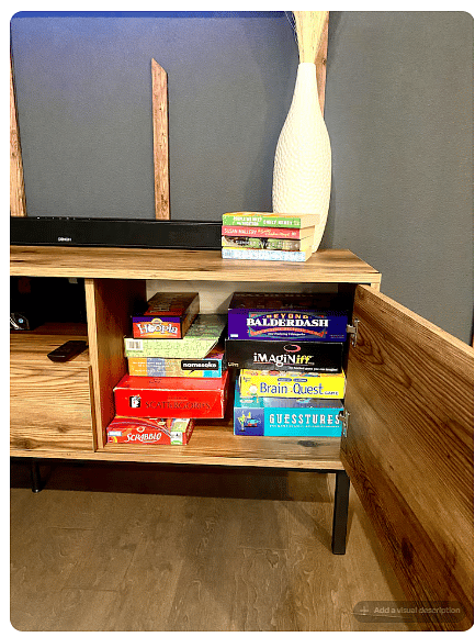 Guest game collection with favorites for all ages, including Scrabble, Scattergories, Balderdash, Imaginiff & more.
Conveniently stored in the living area for easy accessperfect for family game nights, friendly competition & downtime.
