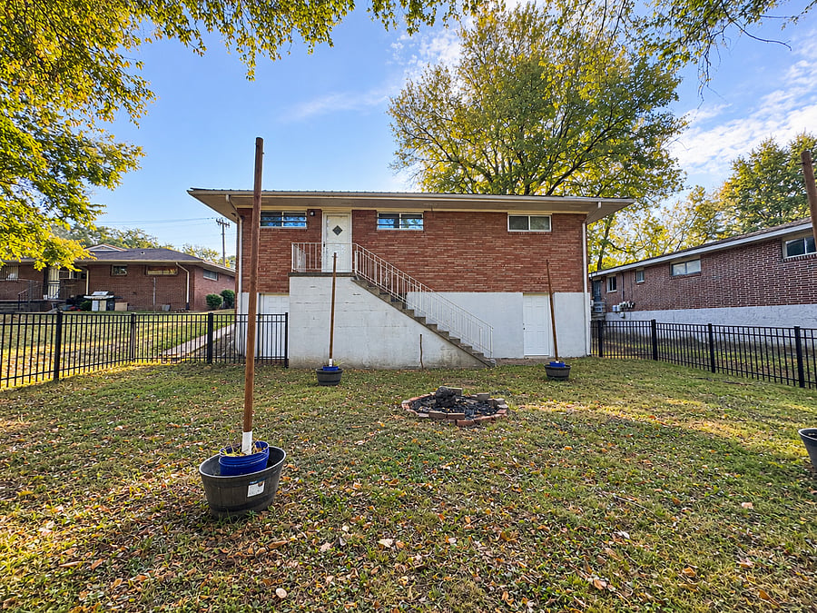Private, fenced in large backyard. View toward kitchen back door.