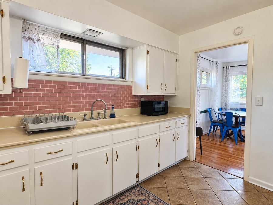 Kitchen view from back door (leads to fenced in backyard).