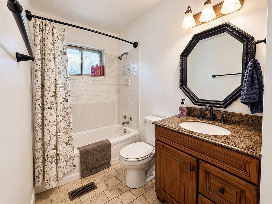 Bathroom; located in the hallway amongst bedrooms. Includes, linen closet, linens, hairdryer, starter shower essentials, starter cleaning essentials.