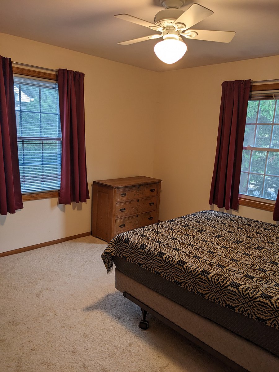 Private bedroom with room darkening curtains and comfy queen foam bed.