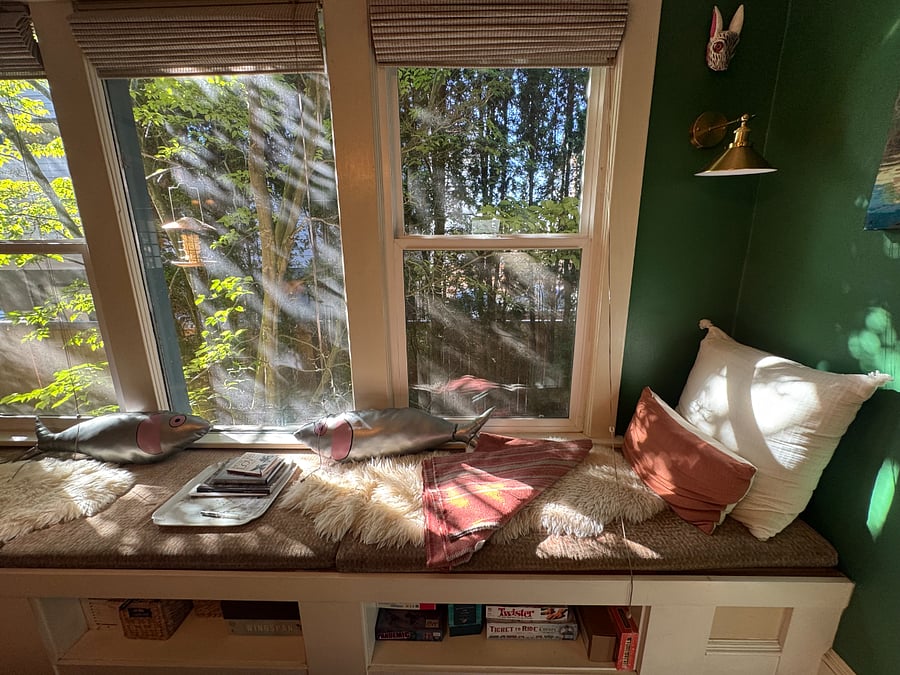 Dining room window seat -- the perfect place to enjoy your morning coffee. 